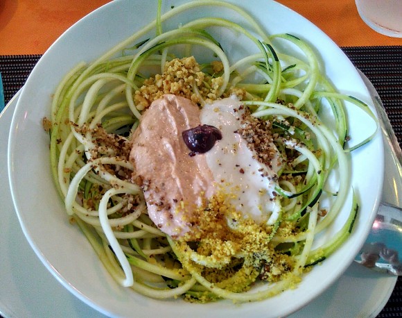 Raw zucchini spaghetti with two raw-vegan sauces: meat-taste and cheese-taste (both made of nuts)